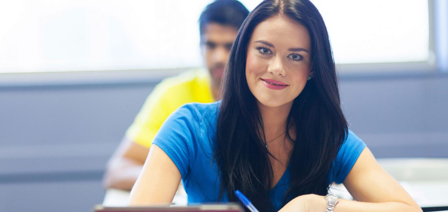 Student smiling in class.