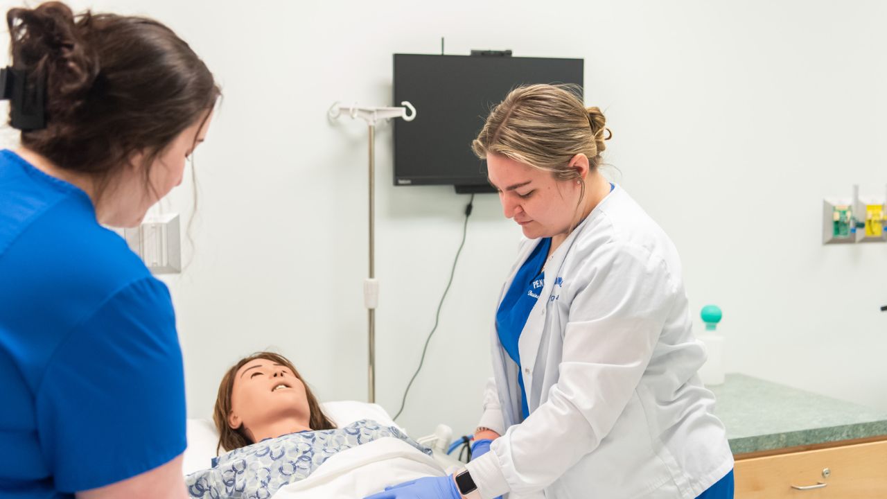 Penn Commercial nursing students work on a sample patient